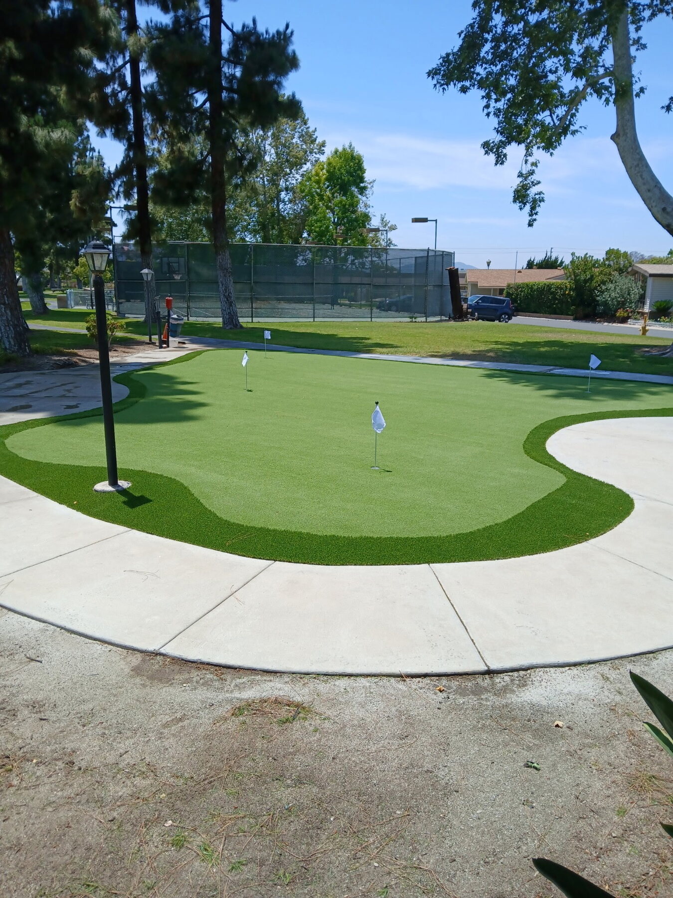 A completed multi-cup putting green by Buono Built in San Diego